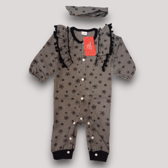 Black and white checkered one-piece outfit for a baby